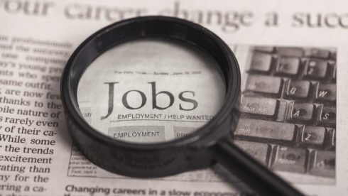 magnifying glass showing the word 'jobs'